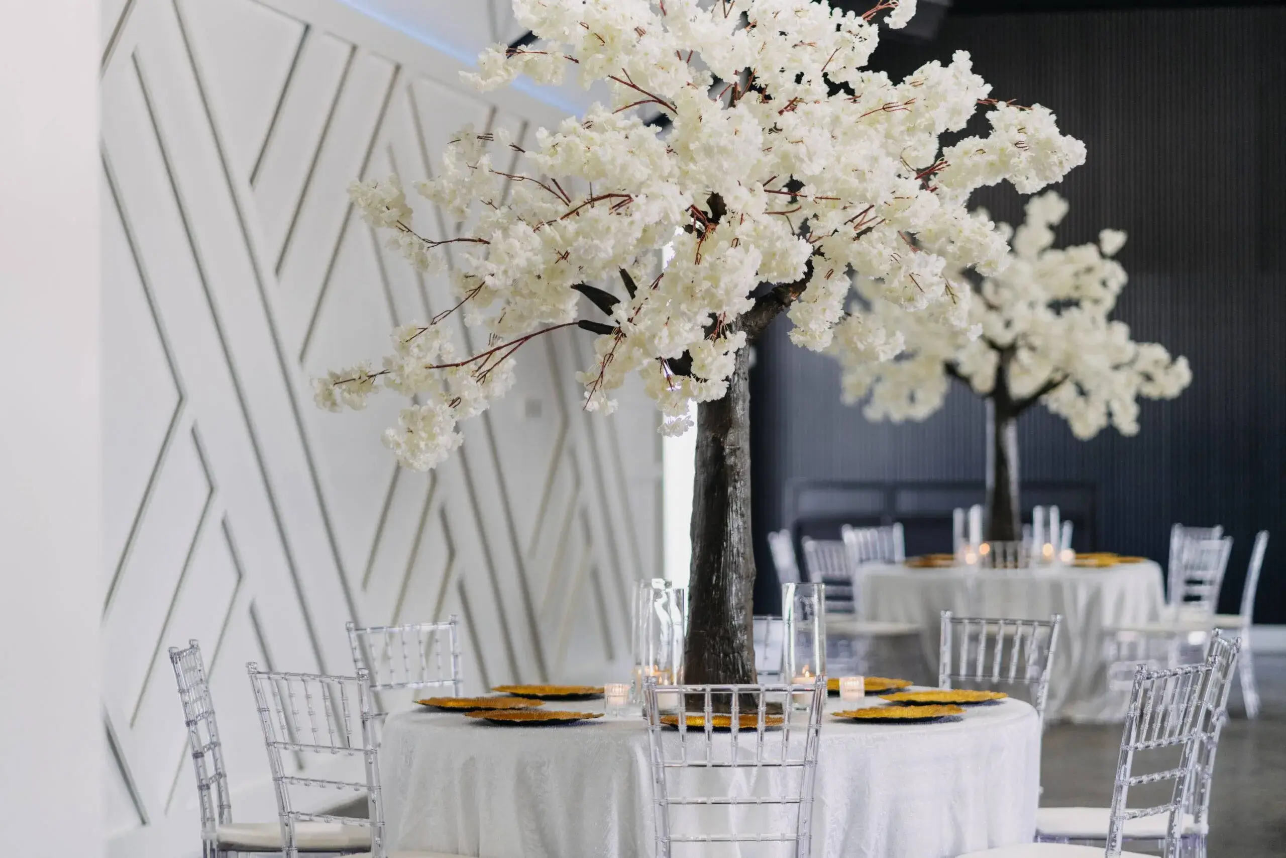 Reception hall — white floral centerpieces at Copacabana Hall